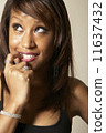 African American woman biting finger 11637432