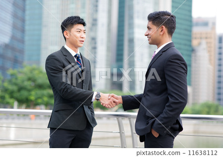 Partners sealing cooperation or agreement with a handshake - Large 11638112