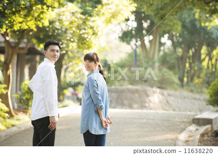 A couple walking in the park A couple walking in the park 11638220