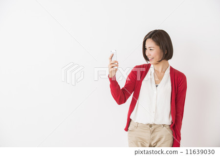 A young woman with a smartphone A young woman with a smartphone 11639030