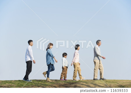 Three generations family walking with blue sky 11639333