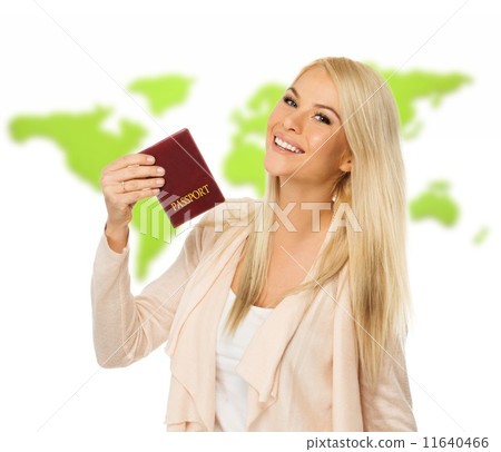 Happy blond woman with passport against world map Happy blond woman with passport against world map 11640466