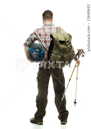 Traveler with backpack, hiking poles and sleeping bag Traveler with backpack, hiking poles and sleeping bag 11640683