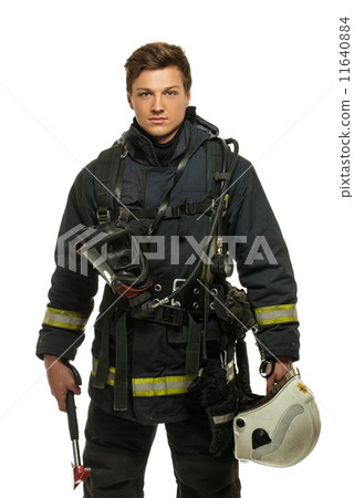 Young firefighter with helmet and axe isolated on white 11640884