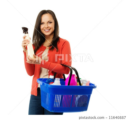 Beautiful cheerful brunette woman with basket full and bottle of cleanser Beautiful cheerful brunette woman with basket full and bottle of cleanser 11640887
