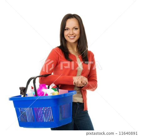 Beautiful cheerful brunette woman with basket full of cleansers Beautiful cheerful brunette woman with basket full of cleansers 11640891