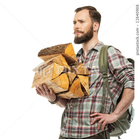 Handsome traveler with backpack and logs for bonfire Handsome traveler with backpack and logs for bonfire 11640908