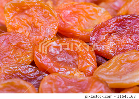 red and orange dried apricots in close-up red and orange dried apricots in close-up 11643168