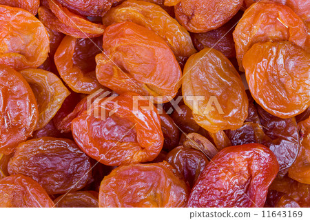 red and orange dried apricots in close-up 11643169
