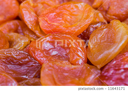 red and orange dried apricots in close-up red and orange dried apricots in close-up 11643171