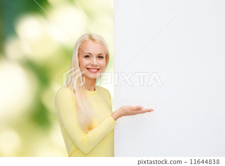 smiling woman in sweater with blank white board smiling woman in sweater with blank white board 11644838