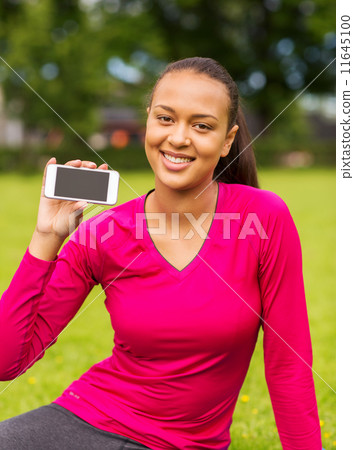 smiling african american woman with smartphone smiling african american woman with smartphone 11645100