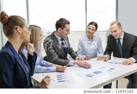 smiling business team at meeting smiling business team at meeting 11645102