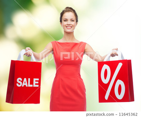 young woman in red dress with shopping bags young woman in red dress with shopping bags 11645362