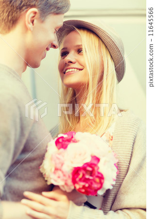 happy couple with flowers in the city happy couple with flowers in the city 11645566