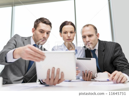 business team with tablet pc having discussion business team with tablet pc having discussion 11645731