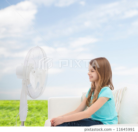 smiling little girl with big fan at home smiling little girl with big fan at home 11645991