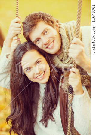 romantic couple in the autumn park romantic couple in the autumn park 11646361