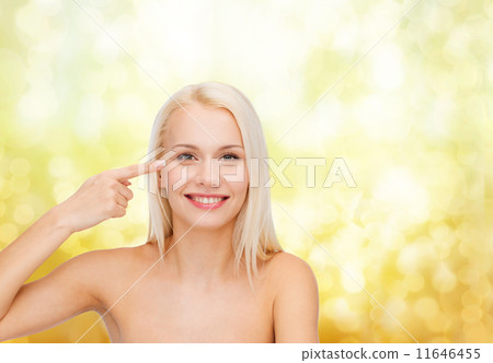 beautiful woman touching her eye area 11646455
