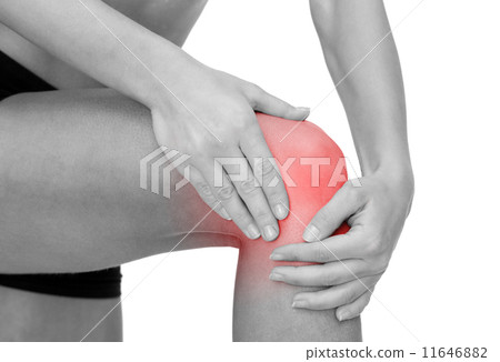 close up of female hands holding knee 11646882