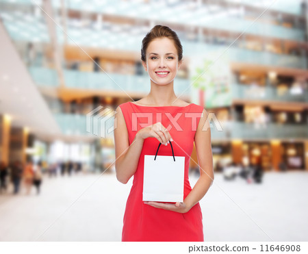 smiling elegant woman in dress with shopping bag 11646908