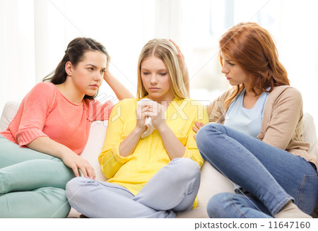 two teenage girls comforting another after breakup two teenage girls comforting another after breakup 11647160