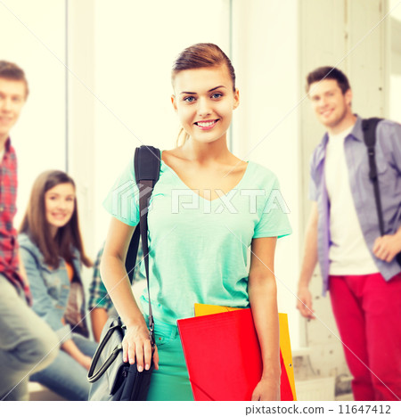 student girl with school bag and color folders 11647412