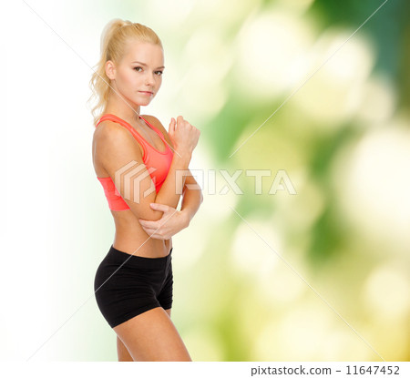 sporty woman with pain in elbow sporty woman with pain in elbow 11647452