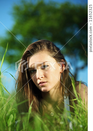 brunette on grass 11652325