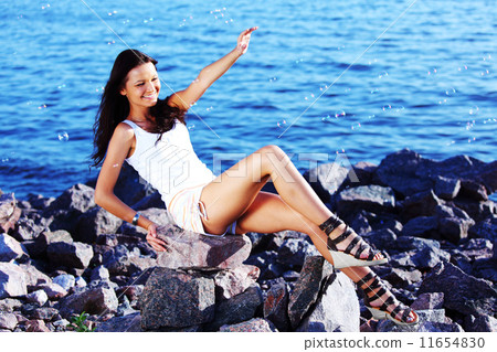 brunette near sea 11654830