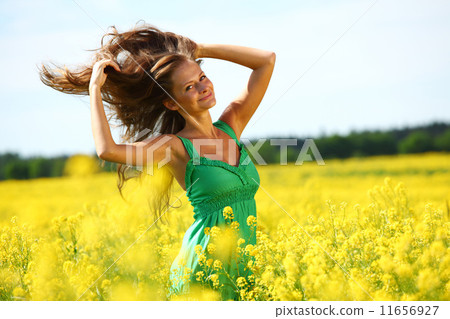 woman on oilseed field 11656927
