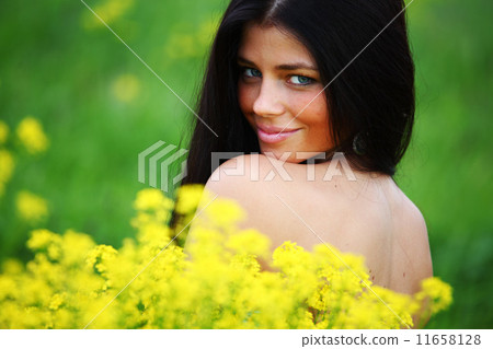 woman on oilseed field 11658128