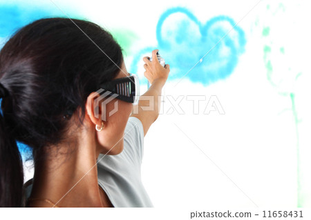 woman paints the wall 11658431