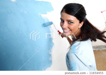 roller in woman hand 11658455