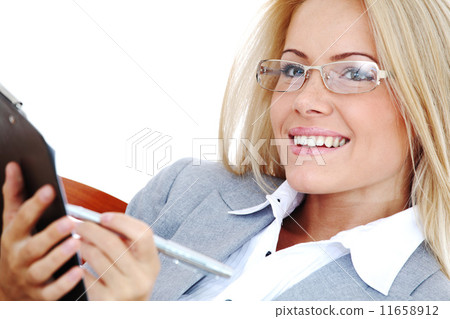 business woman hold a folder and write business woman hold a folder and write 11658912