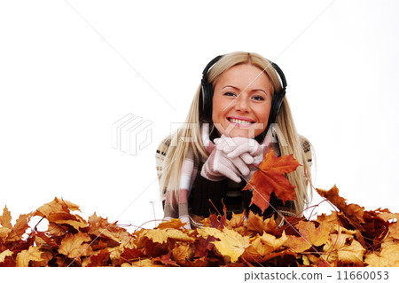 autumn woman listening music 11660053