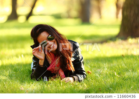 woman on green grass 11660436