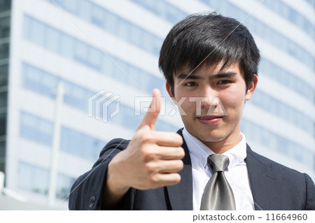 Asian businessman thumbs up 11664960