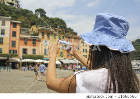 Portofino, Woman photographing with mobile phone Portofino, Woman photographing with mobile phone 11666566
