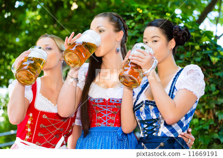 Beer garden - friends in traditional clothes in bavaria 11669191