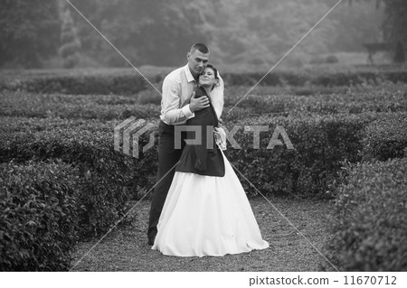 Photo of groom hugging bride at cold day Photo of groom hugging bride at cold day 11670712