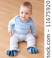 beautiful laughing baby boy sitting 11675920
