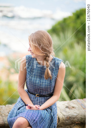 Girl looking at the city of Cannes 11676040