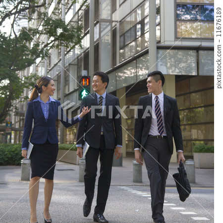 Confident Asian Business Team on the move Confident Asian Business Team on the move 11676189