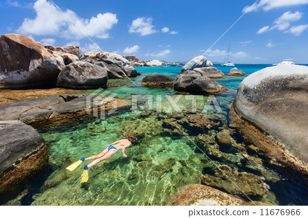 Woman snorkeling at tropical water Woman snorkeling at tropical water 11676966