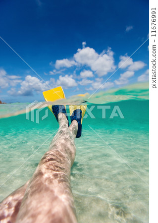 Split photo of woman legs with fins Split photo of woman legs with fins 11676991
