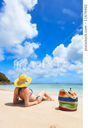 Young woman relaxing at beach 11676992