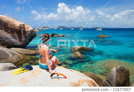 Woman with snorkeling equipment at tropical beach Woman with snorkeling equipment at tropical beach 11677007