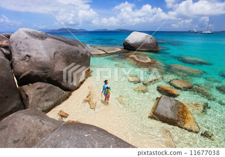 Woman with snorkeling equipment at tropical beach Woman with snorkeling equipment at tropical beach 11677038
