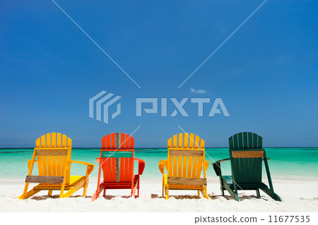 Colorful chairs on Caribbean beach 11677535